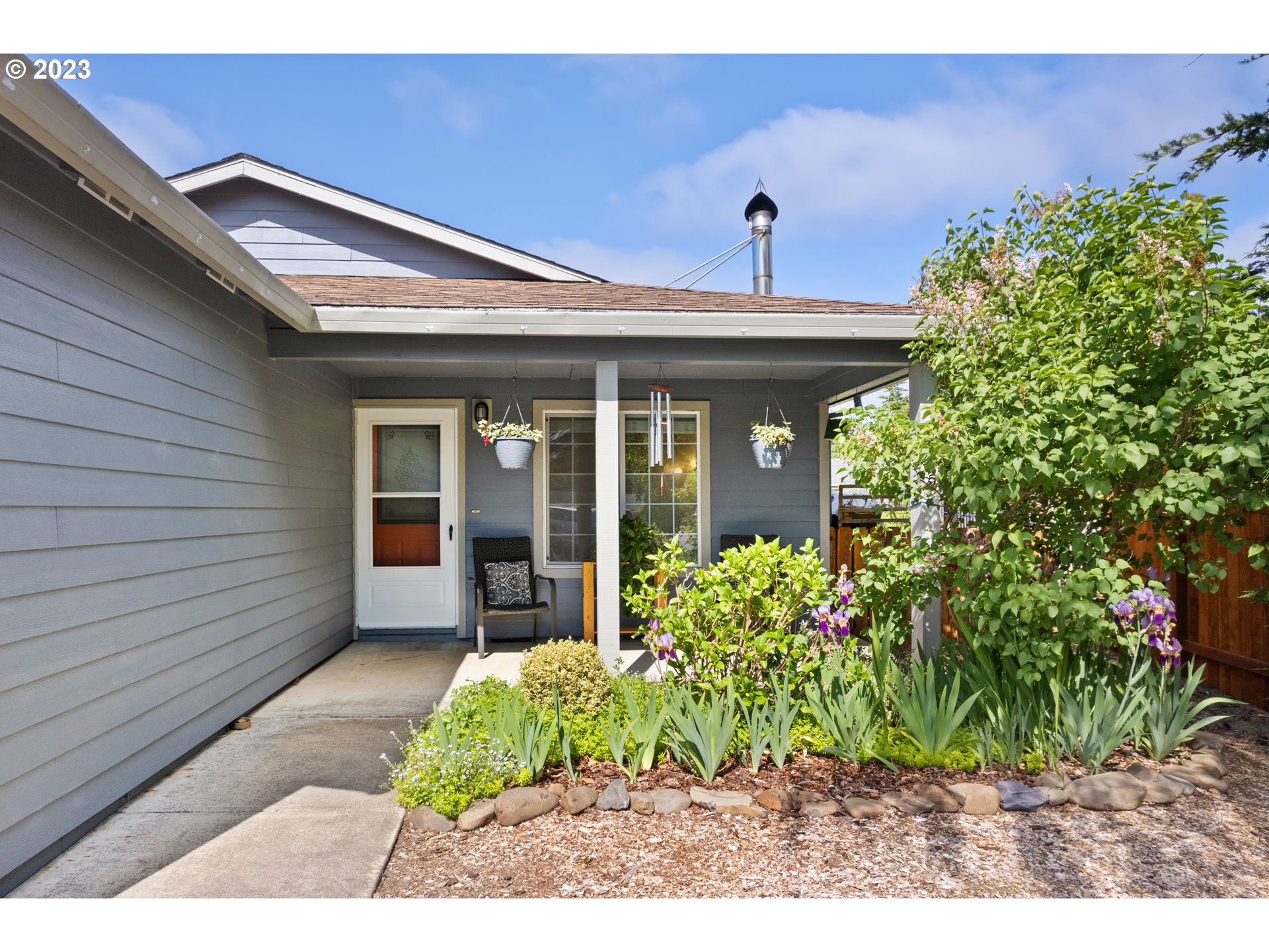 34100 Pintail Avenue Nehalem, OR 97131 - Photo 5 of 31 a front view of a house with garden