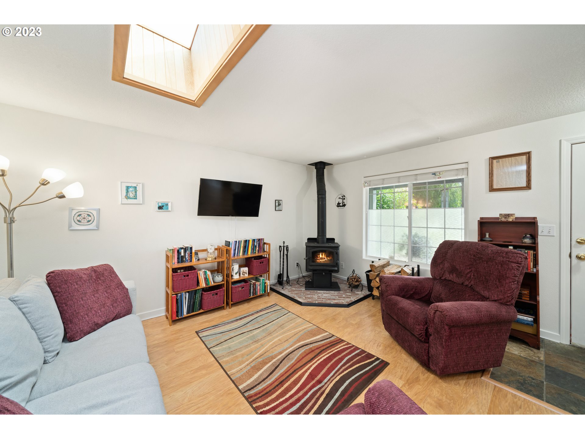 34100 Pintail Avenue Nehalem, OR 97131 - Photo 6 of 31 a bedroom with furniture and a flat screen tv