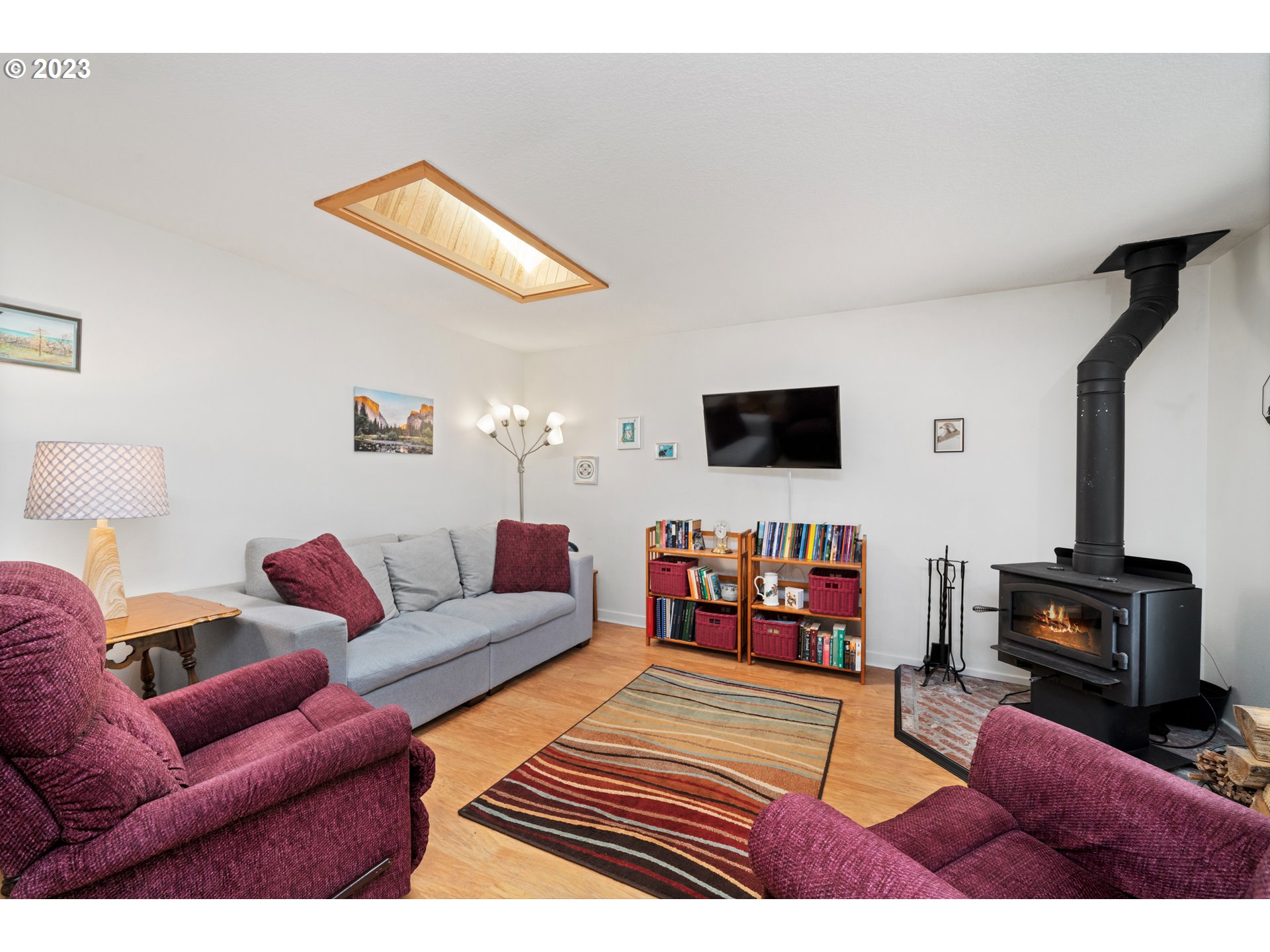 34100 Pintail Avenue Nehalem, OR 97131 - Photo 7 of 31 a bedroom with furniture and a flat screen tv