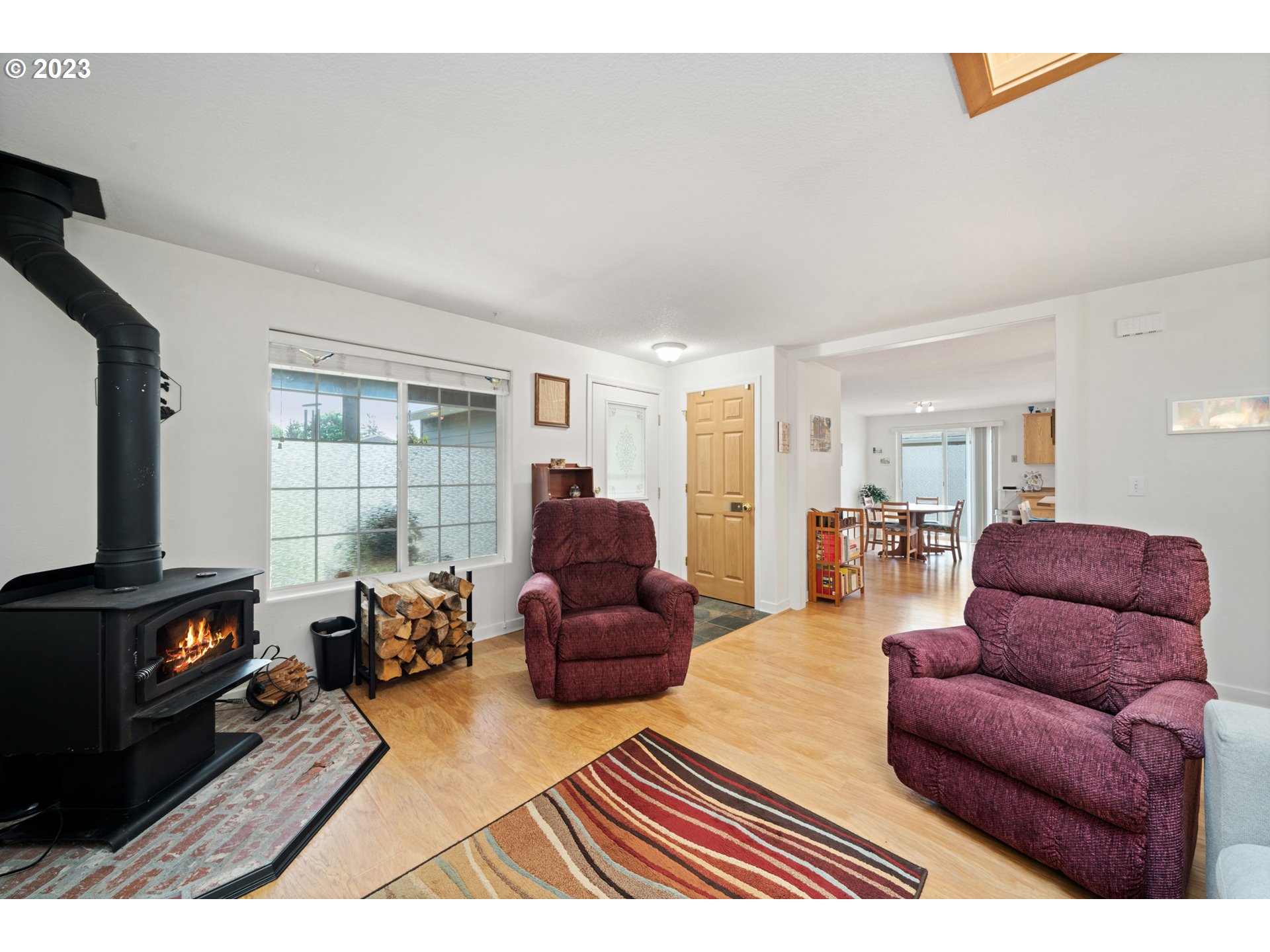 34100 Pintail Avenue Nehalem, OR 97131 - Photo 8 of 31 a living room with furniture a flat screen tv and a window
