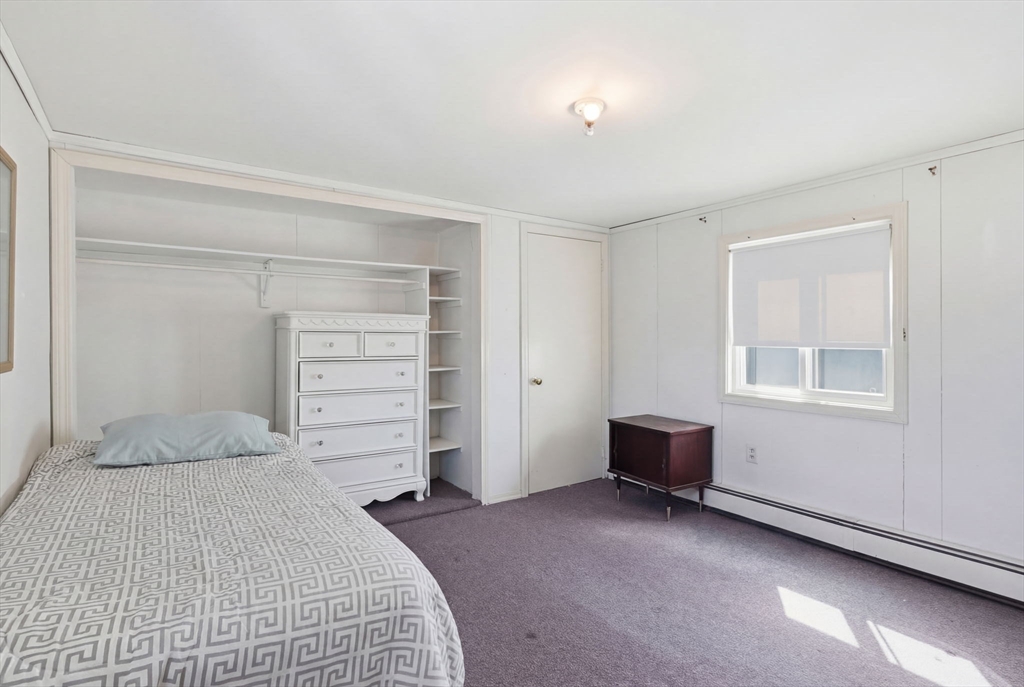 1080 Shirley Street Winthrop, MA 02152 - Photo 11 of 21 a bedroom with a bed and a window