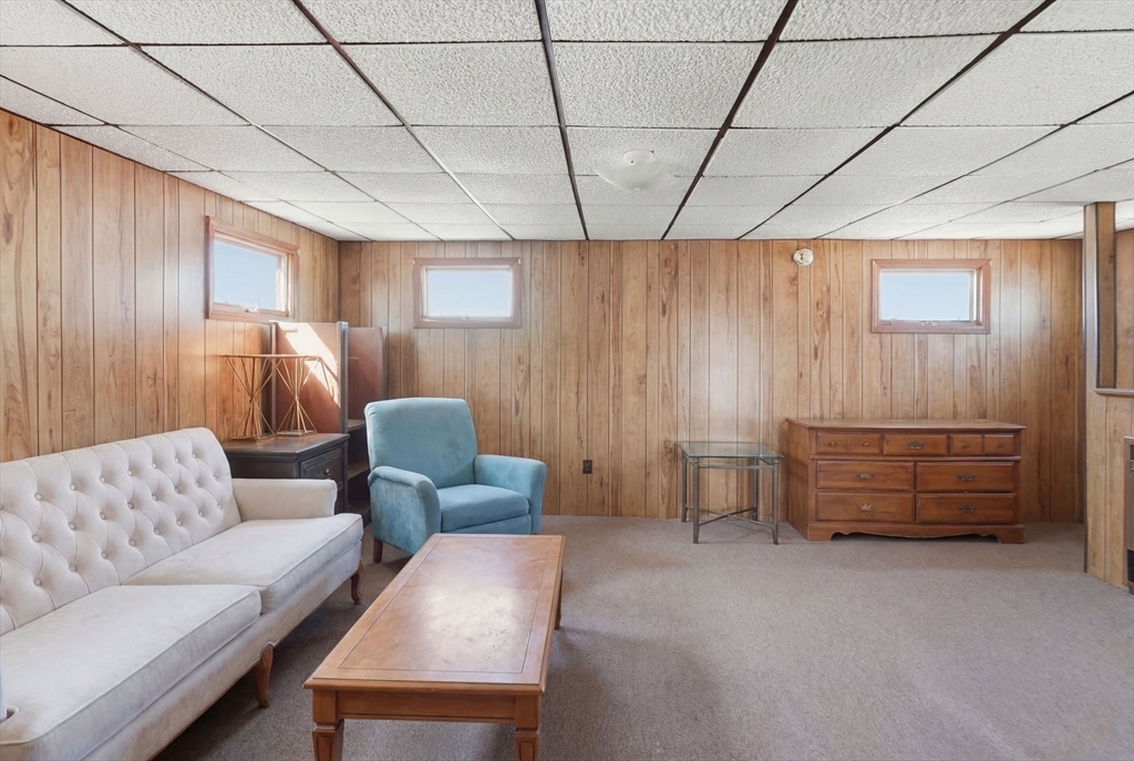 1080 Shirley Street Winthrop, MA 02152 - Photo 16 of 21 a living room with furniture and a window