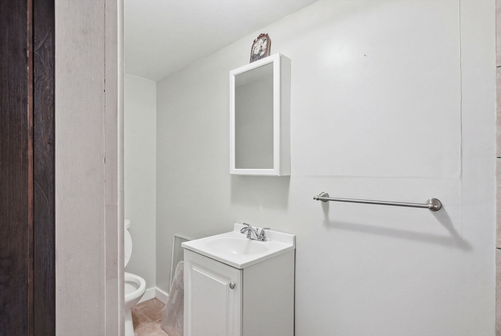1080 Shirley Street Winthrop, MA 02152 - Photo 17 of 21 a utility room with a sink dryer and washer