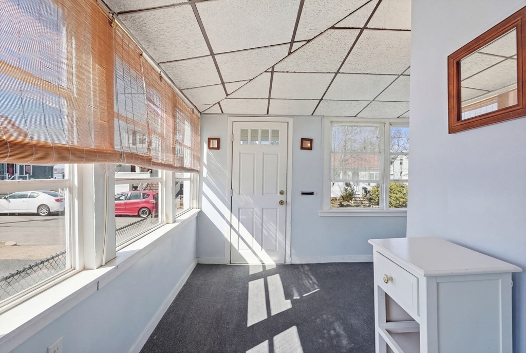 1080 Shirley Street Winthrop, MA 02152 - Photo 6 of 21 a view of an entryway with wooden shelves