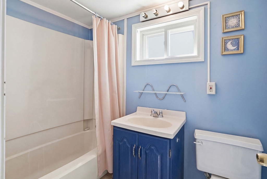 1080 Shirley Street Winthrop, MA 02152 - Photo 10 of 21 a bathroom with a sink a toilet and a bathtub
