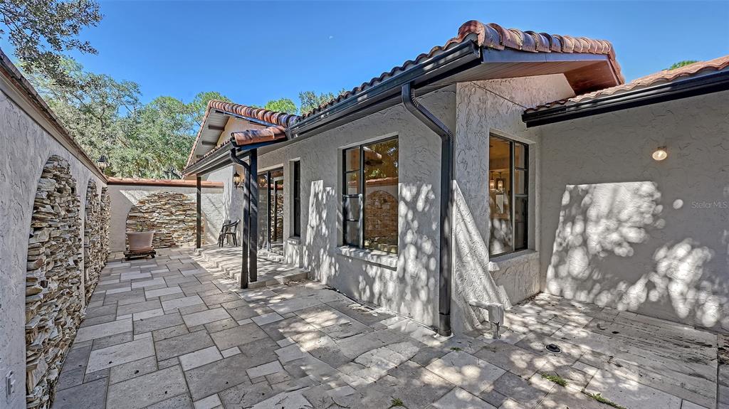 4674 Hidden River Road Sarasota, FL 34240 - Photo 15 of 46 a view of a house with a yard