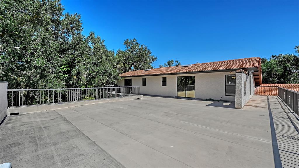 4674 Hidden River Road Sarasota, FL 34240 - Photo 25 of 46 a view of a house with a outdoor space