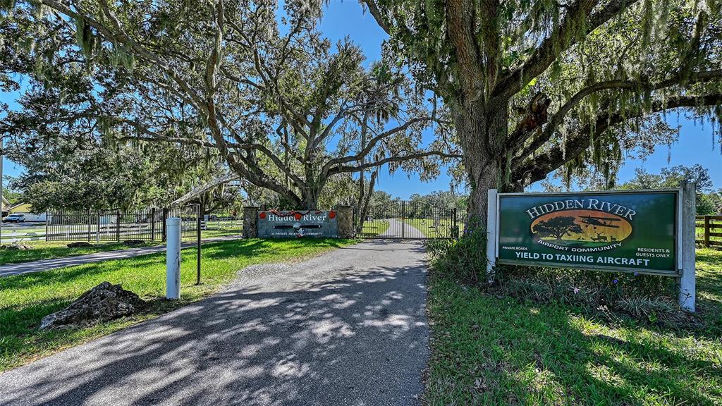 4674 Hidden River Road Sarasota, FL 34240 - Photo 42 of 46 a view of a park with large trees