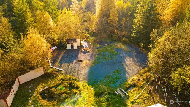 a house with trees in the background