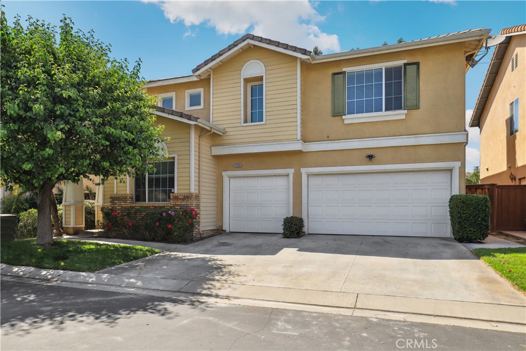 11155 Springdale Court Riverside, CA 92505 - Photo 1 of 1 a front view of a house with a yard and garage
