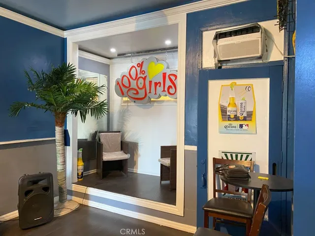 a store room with furniture and a potted plant