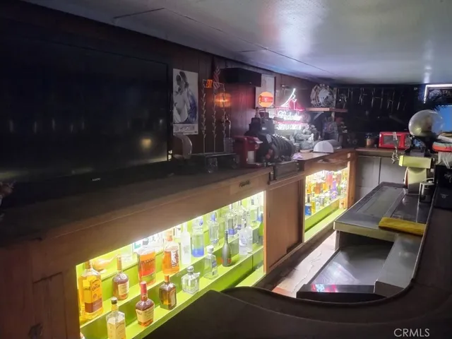 a room with furniture pool table and window