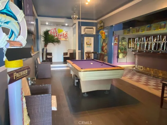 a room with furniture and a flat screen tv