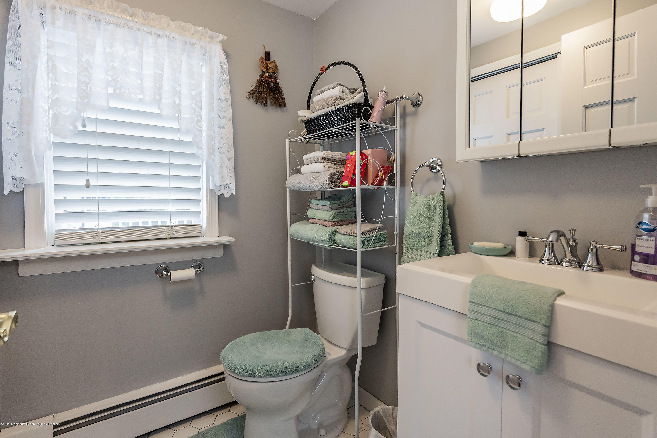 7 Wooleytown Road Morganville, NJ 07751 - Photo 14 of 30 a kitchen with a sink appliances and cabinets
