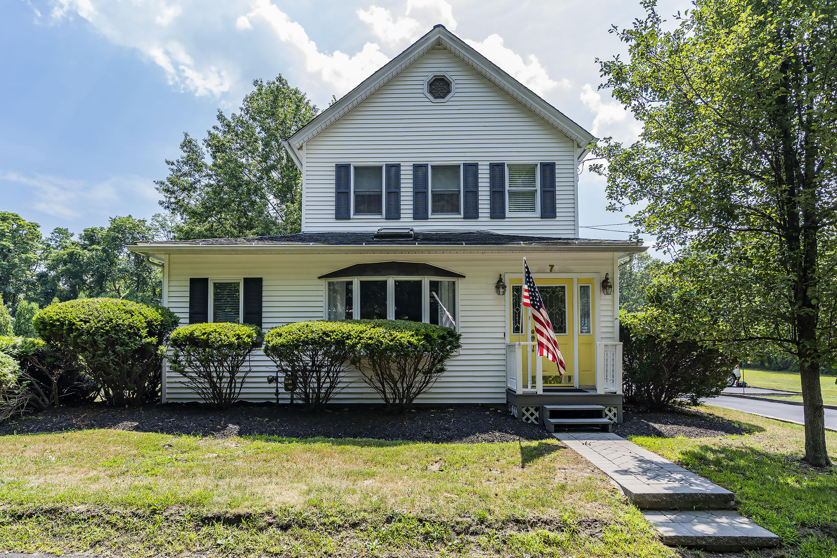 7 Wooleytown Road Morganville, NJ 07751 - Photo 2 of 30 a front view of a house with garden