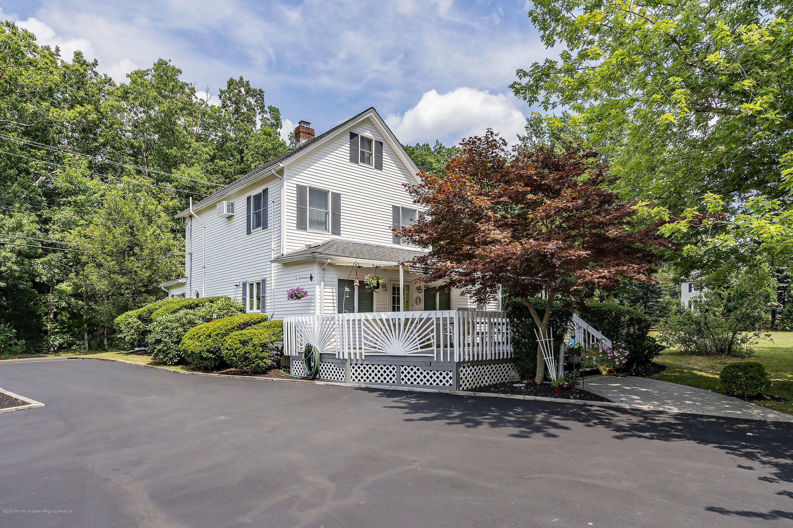 7 Wooleytown Road Morganville, NJ 07751 - Photo 24 of 30 a front view of a house with a garden