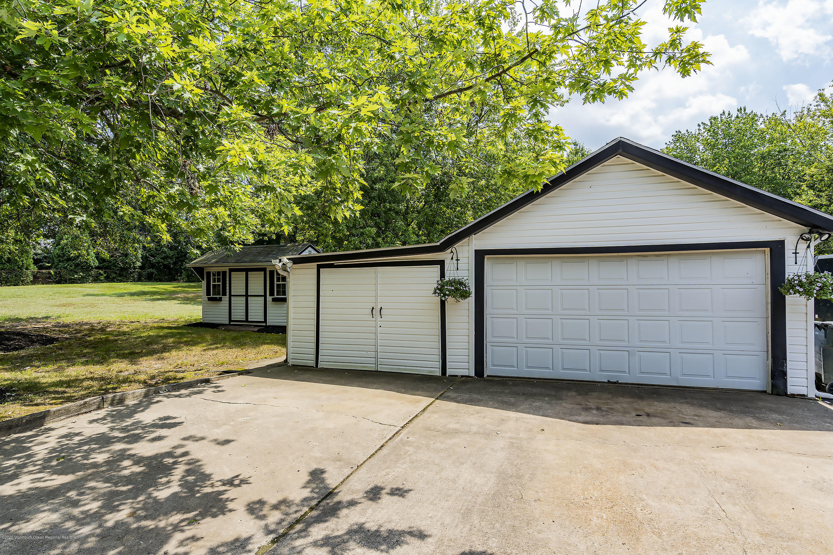 7 Wooleytown Road Morganville, NJ 07751 - Photo 25 of 30 a view of backyard of house and garage