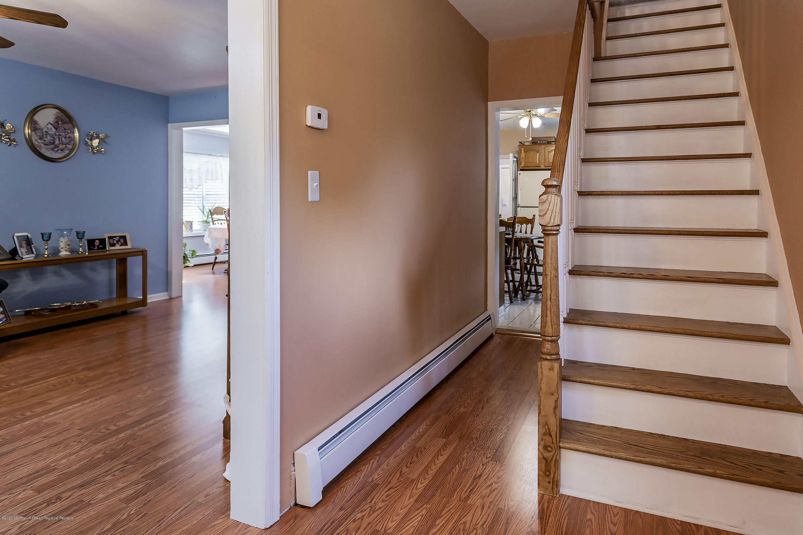 7 Wooleytown Road Morganville, NJ 07751 - Photo 5 of 30 a view of a hallway with wooden floor and staircase