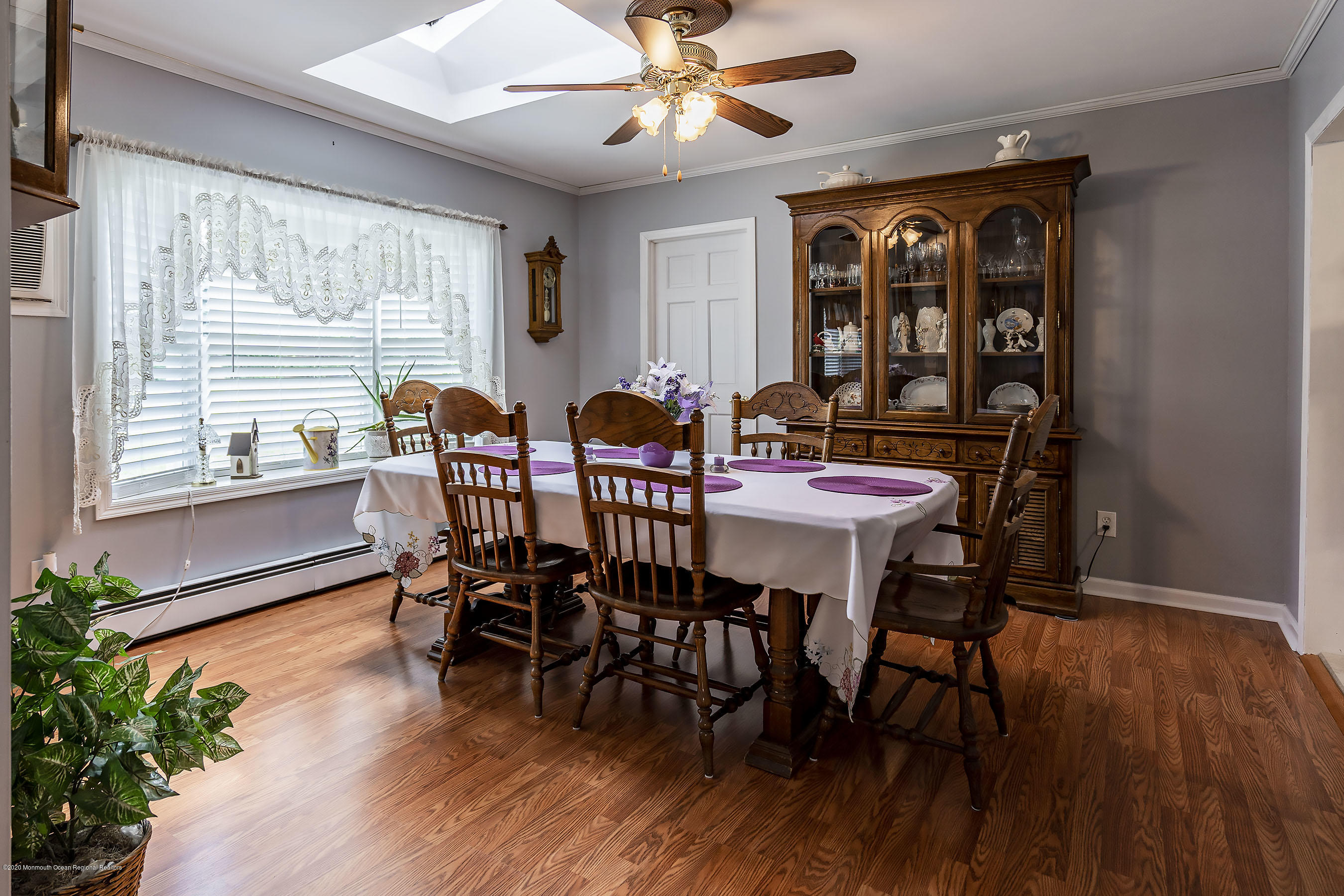 7 Wooleytown Road Morganville, NJ 07751 - Photo 9 of 30 a view of a dining room with furniture window and wooden floor