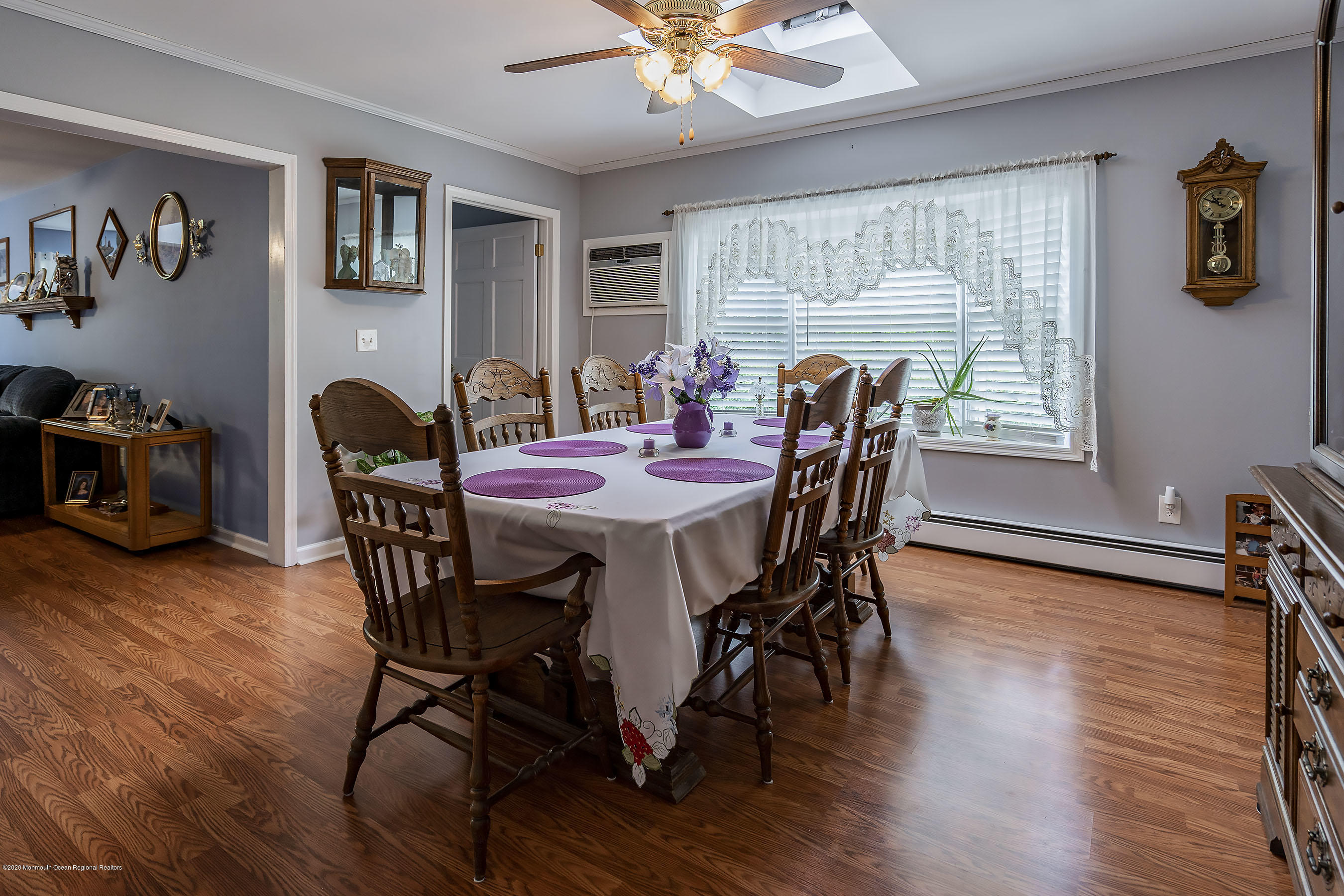 7 Wooleytown Road Morganville, NJ 07751 - Photo 10 of 30 a dining room with furniture a window and wooden floor