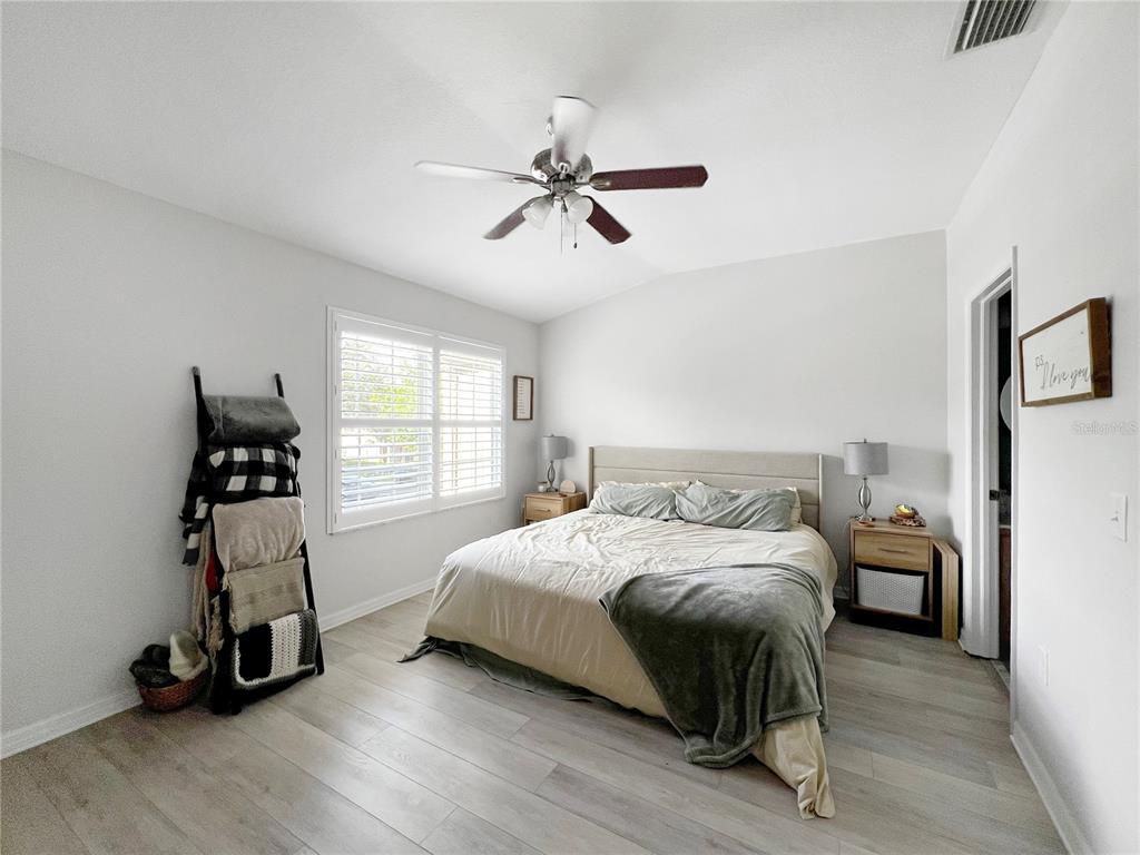 15767 Stable Run Drive Spring Hill, FL 34610 - Photo 23 of 34 a bedroom with a bed and a window