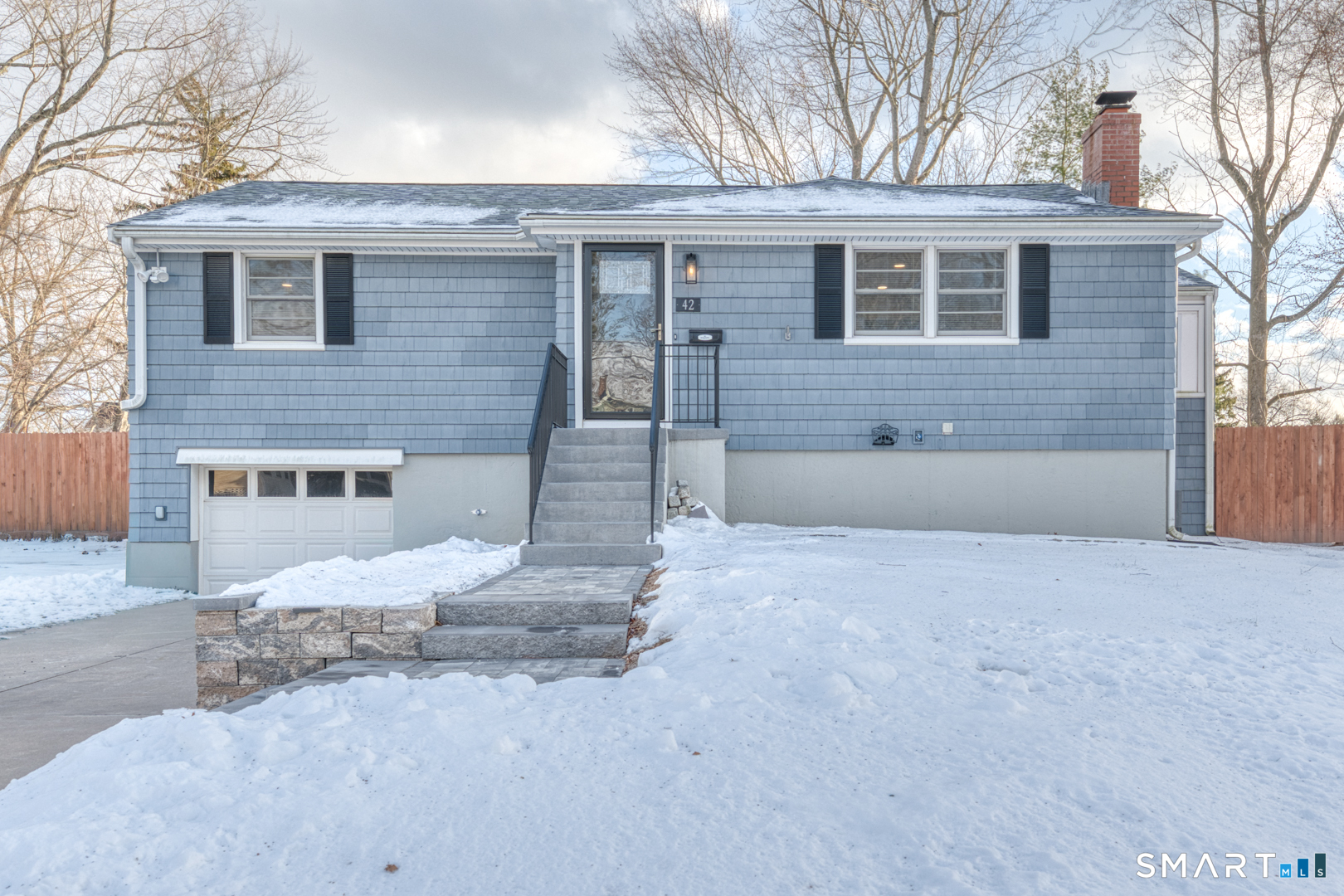 a view of a house with a yard and garage