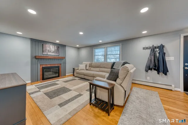 a living room with furniture and a fireplace