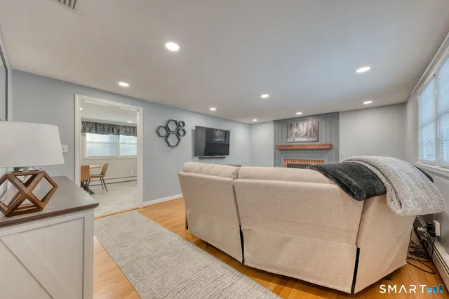 a living room with furniture and a table