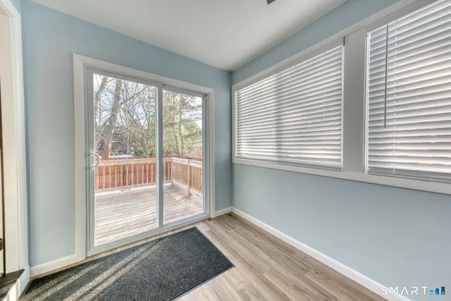 a view of an empty room with a window
