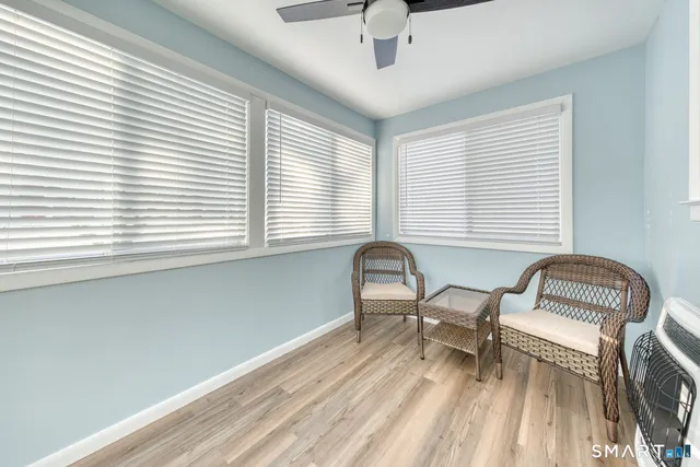 a work room with furniture and windows