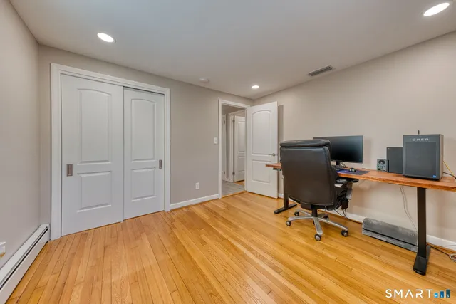 a view of a workspace with furniture
