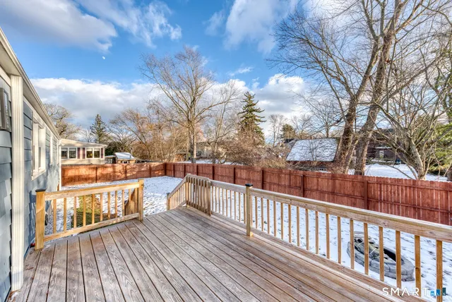 a view of a balcony with wooden fence