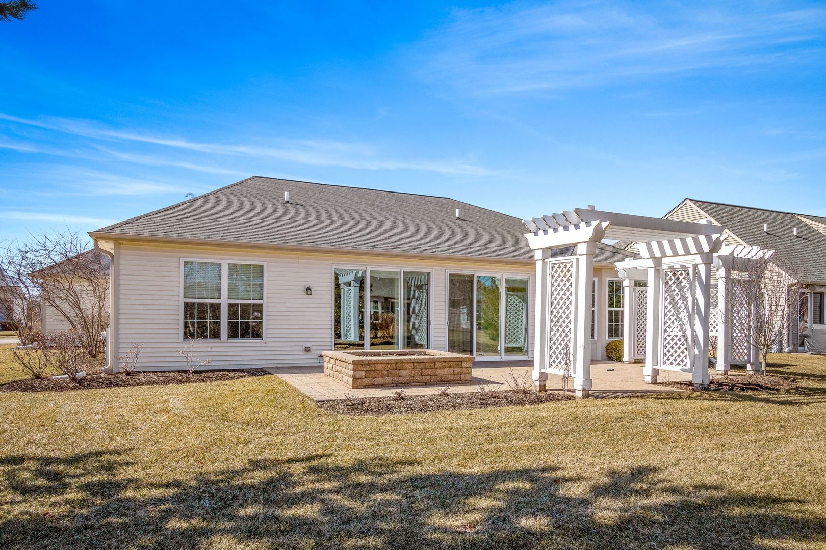 12614 Raintree Path Huntley, IL 60142 - Photo 2 of 28 front view of a house with a swimming pool