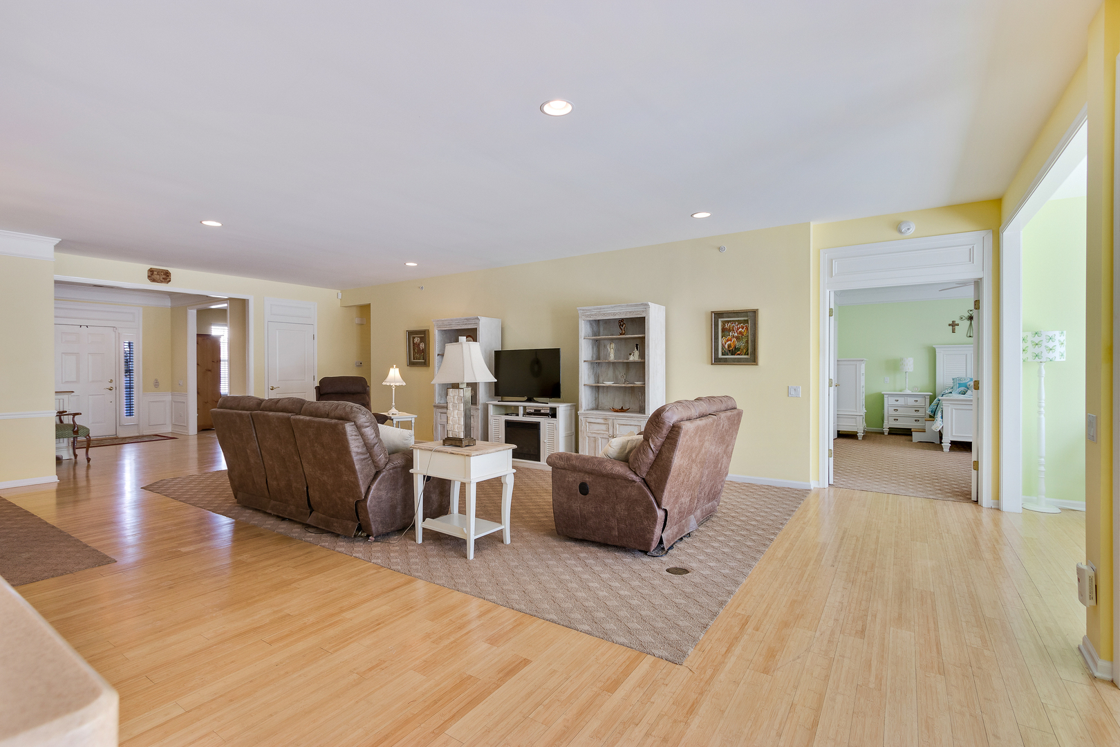 12614 Raintree Path Huntley, IL 60142 - Photo 14 of 28 a living room with furniture a table and wooden floor