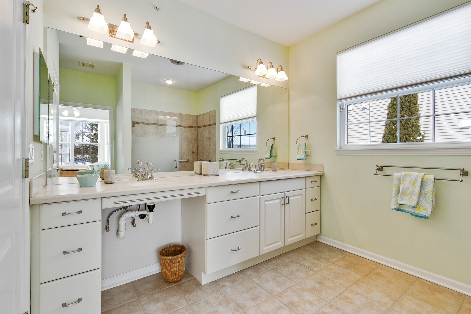 12614 Raintree Path Huntley, IL 60142 - Photo 20 of 28 a spacious bathroom with a granite countertop double vanity sink and a mirror