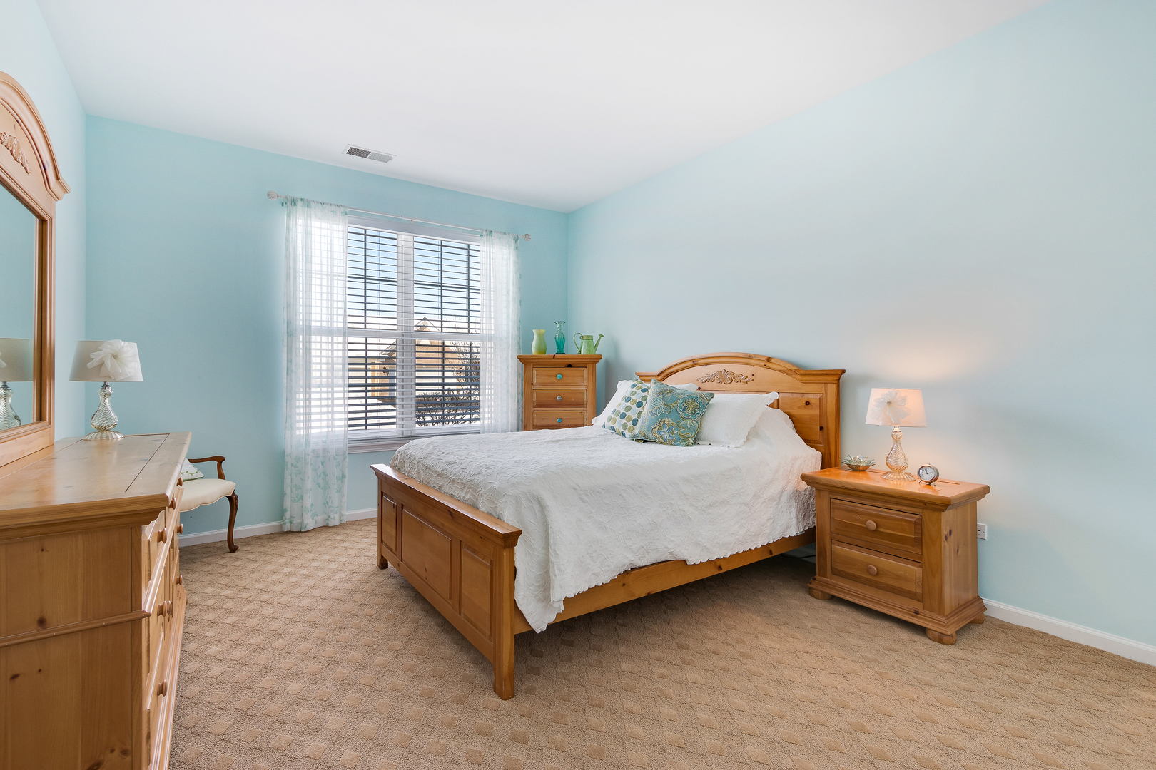 12614 Raintree Path Huntley, IL 60142 - Photo 22 of 28 a bedroom with a bed and a window