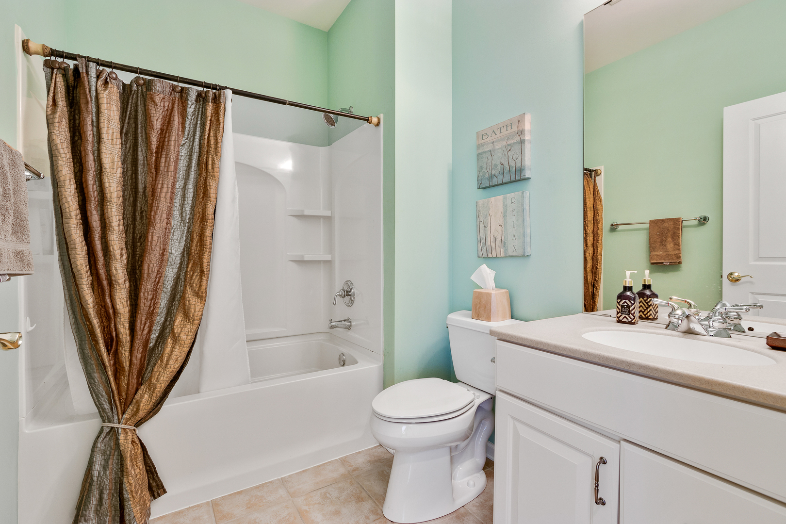 12614 Raintree Path Huntley, IL 60142 - Photo 24 of 28 a bathroom with a sink a toilet a mirror and shower