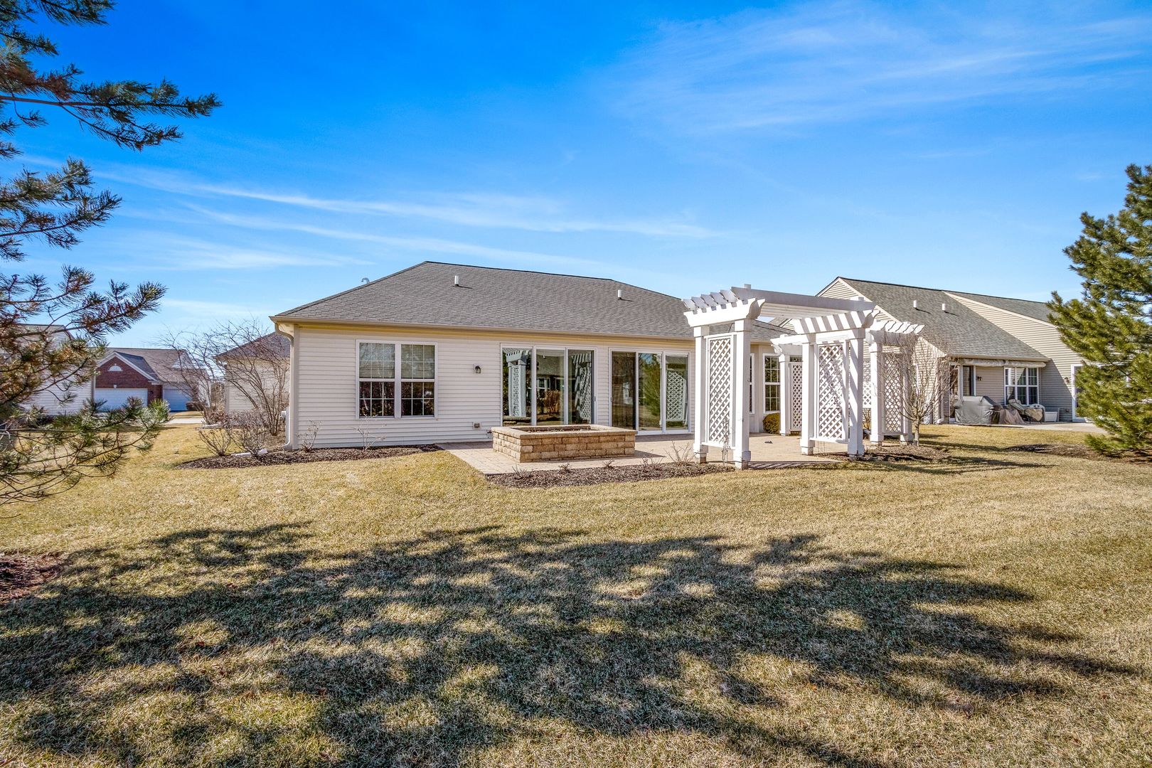 12614 Raintree Path Huntley, IL 60142 - Photo 26 of 28 a front view of a house with a garden