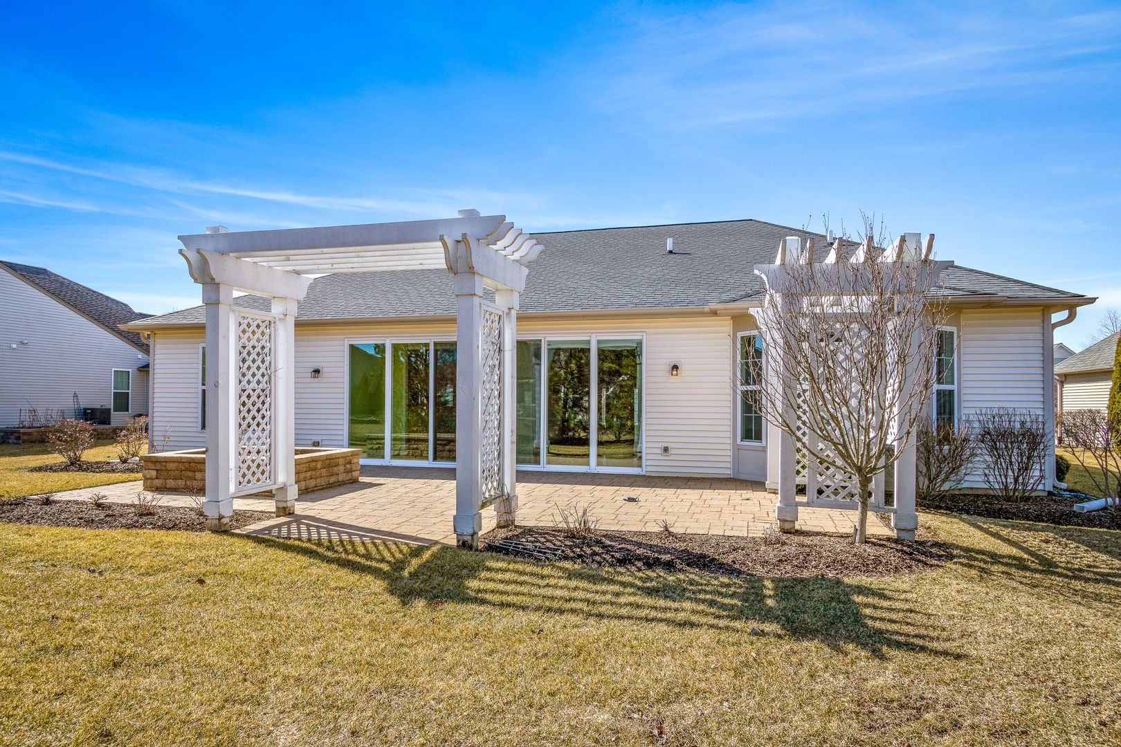 12614 Raintree Path Huntley, IL 60142 - Photo 28 of 28 a front view of a house with a patio