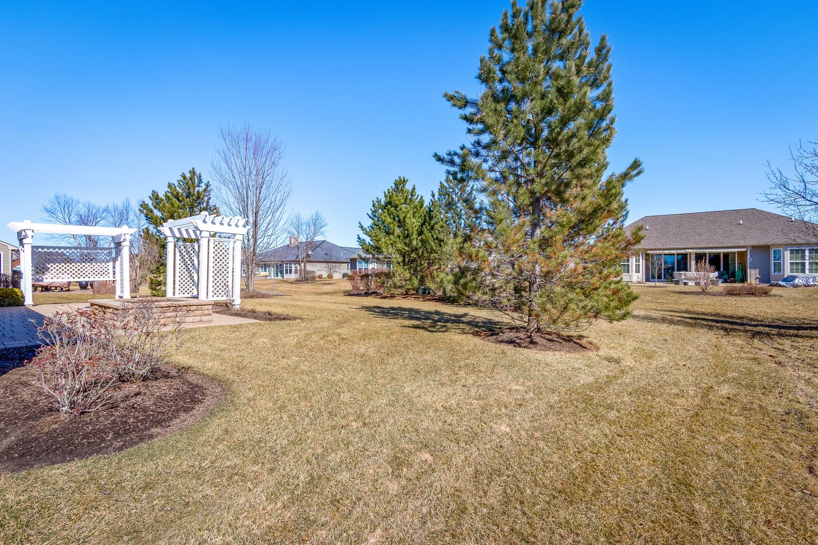 12614 Raintree Path Huntley, IL 60142 - Photo 4 of 28 a front view of a house with a yard