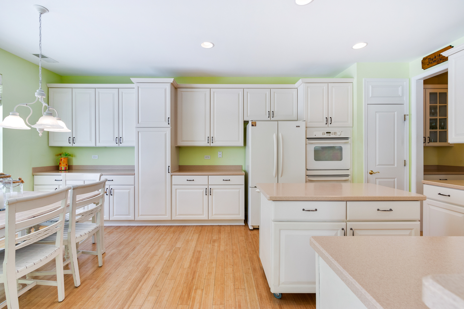 12614 Raintree Path Huntley, IL 60142 - Photo 6 of 28 a kitchen with a sink a stove a refrigerator and cabinets