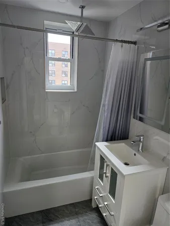 a bathroom with a sink a toilet and a bathtub