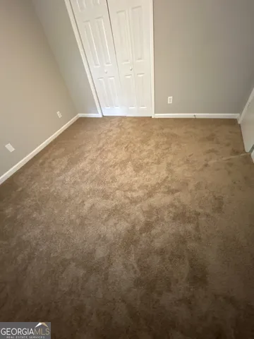 a view of a room with a hanging light