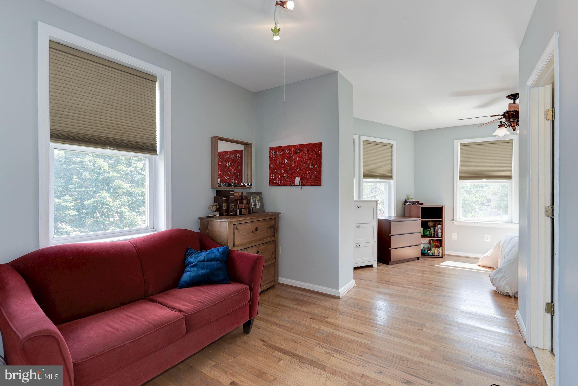 349 Kentucky Avenue Southeast Washington, DC 20003 - Photo 11 of 29 a living room with furniture and a wooden floor