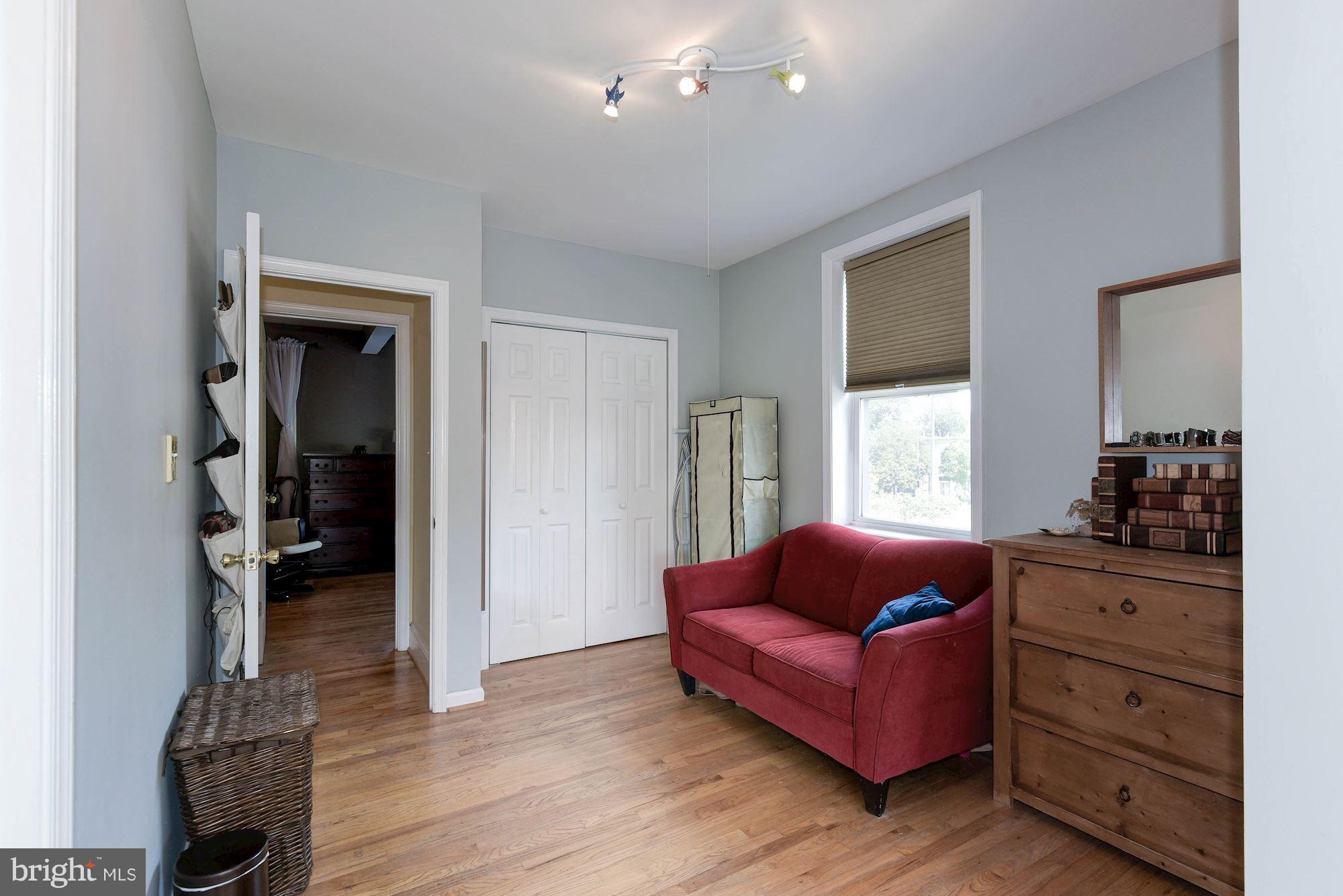 349 Kentucky Avenue Southeast Washington, DC 20003 - Photo 13 of 29 a living room with furniture and a window