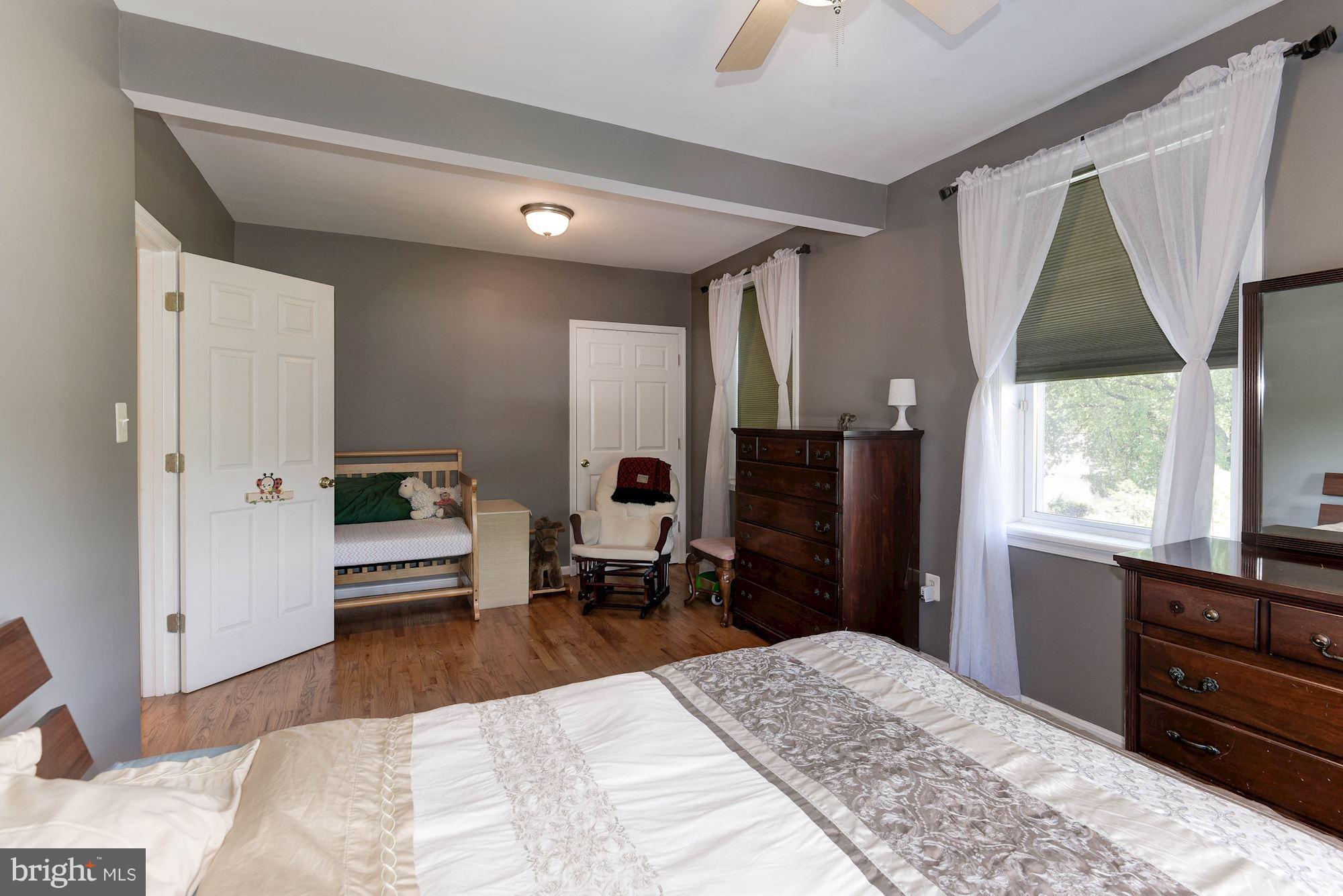 349 Kentucky Avenue Southeast Washington, DC 20003 - Photo 18 of 29 a bedroom with a bed and wooden floor