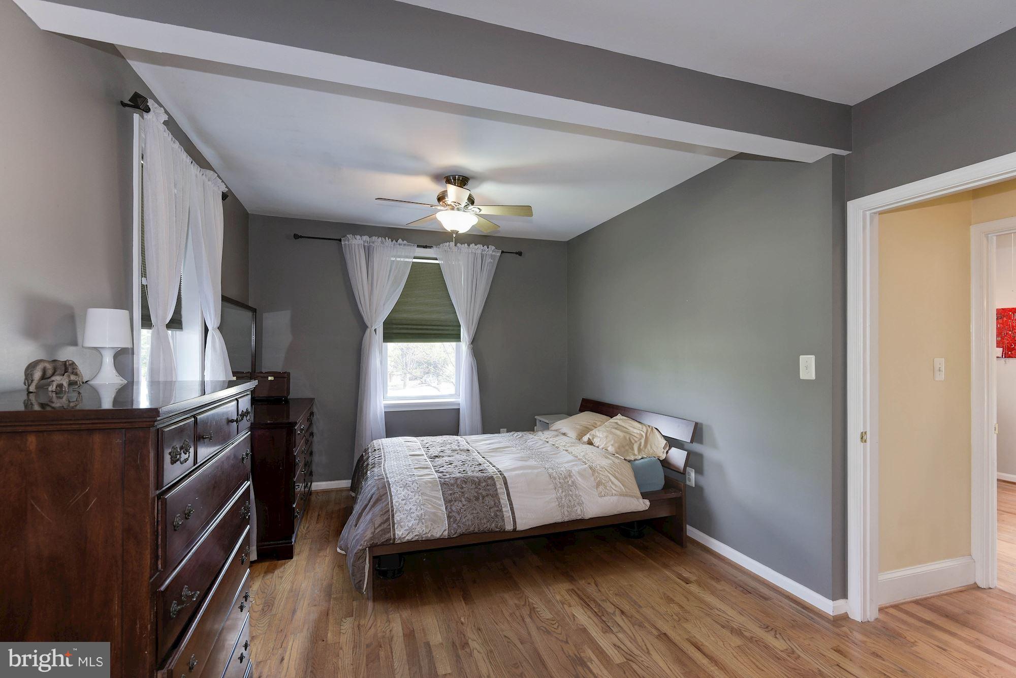 349 Kentucky Avenue Southeast Washington, DC 20003 - Photo 20 of 29 a bedroom with a bed and a chandelier