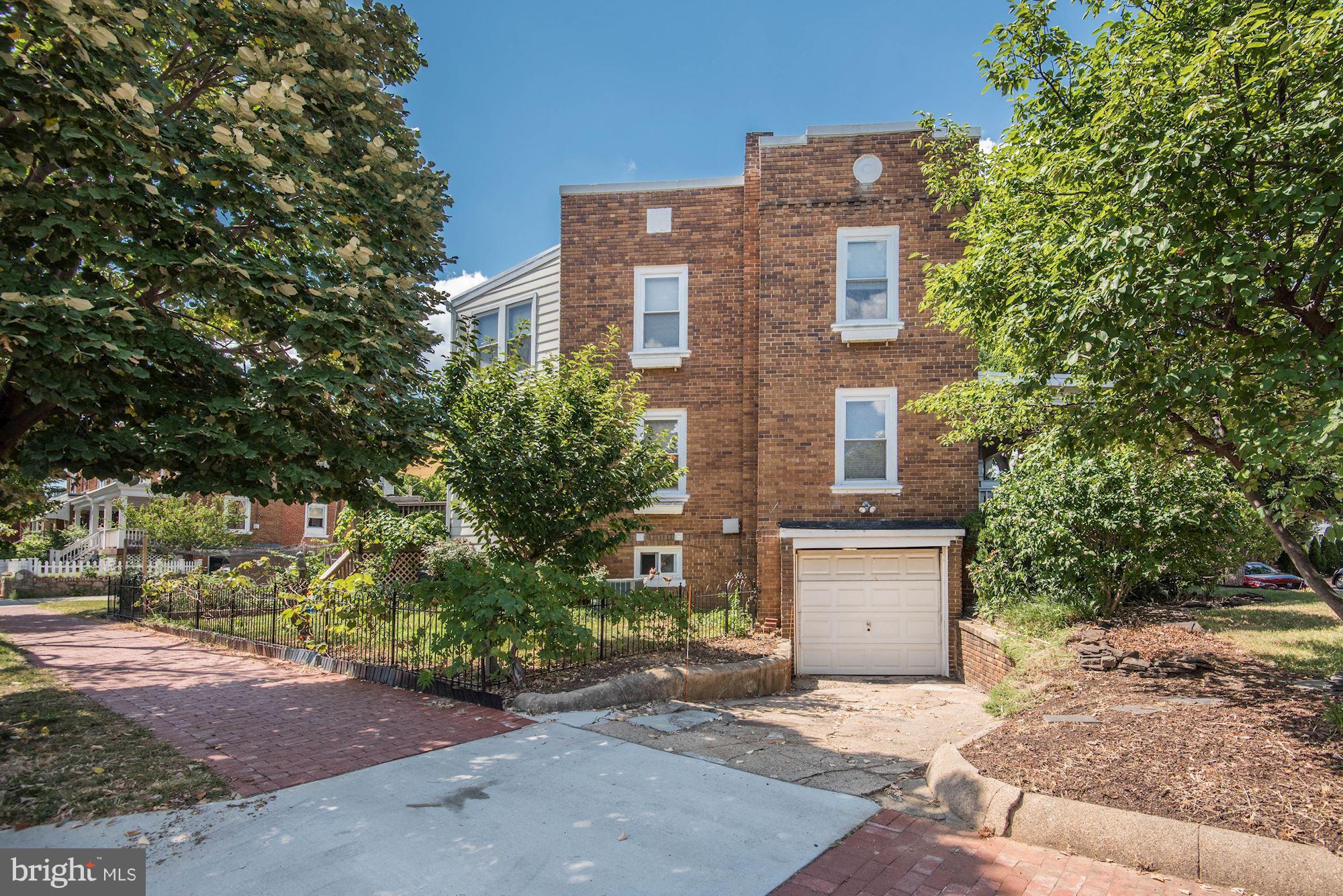 349 Kentucky Avenue Southeast Washington, DC 20003 - Photo 25 of 29 a front view of a house with a garden