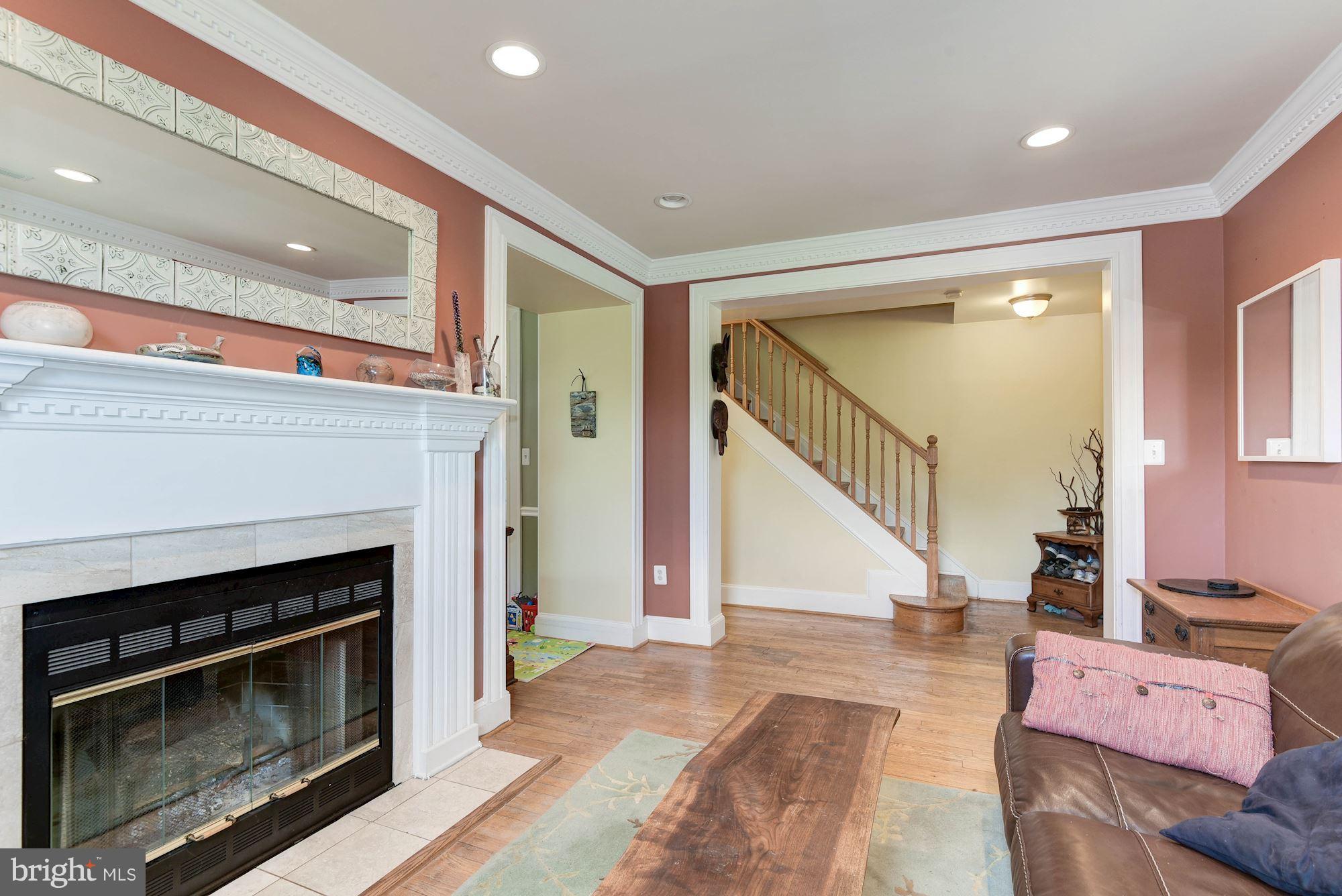 349 Kentucky Avenue Southeast Washington, DC 20003 - Photo 4 of 29 a living room with furniture and a fireplace