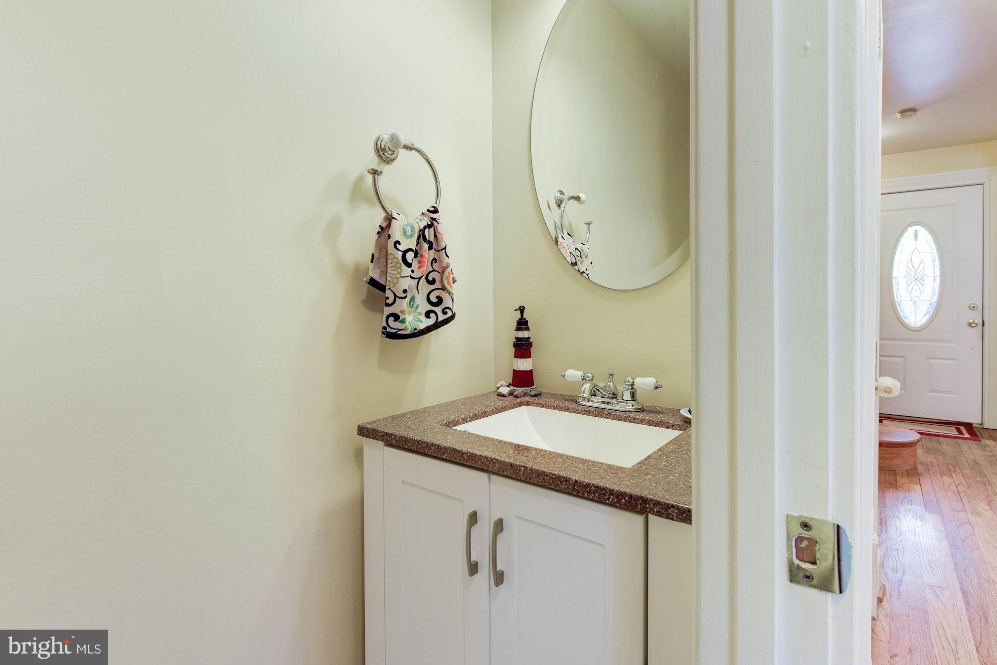349 Kentucky Avenue Southeast Washington, DC 20003 - Photo 7 of 29 a bathroom with a sink and mirror